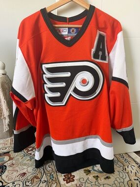 CCM Philadelphia Flyers Orange and Black Hockey Jersey with 'A' Patch